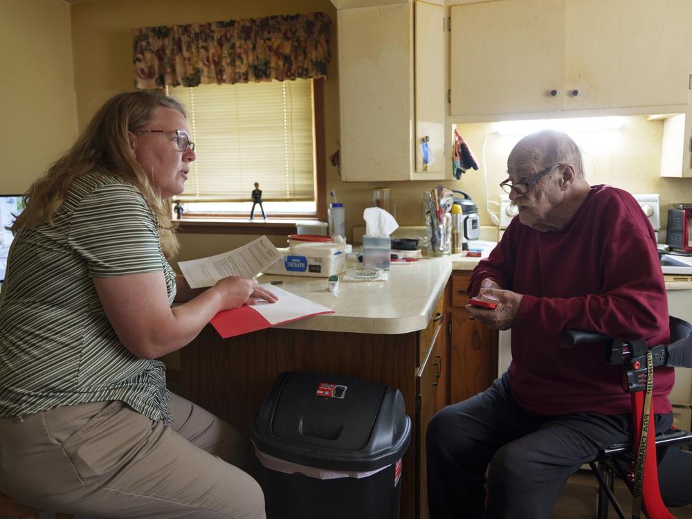 Sanders helps Don Fitterer, 81, fill out a health directive for local EMTs at his home in Glen Ullin. According to Sanders, many of the Western Morton County Aging in Community program's participants don't have family members living nearby or able to help.