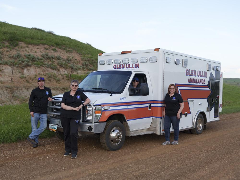 Glen Ullin Ambulance Service EMTs Wade Kottre (from left), Lori Kottre, Dwight Kuntz and Rita Wallin pose for a portrait on a county road in Glen Ullin on May 25. The ambulance service is staffed entirely by volunteers and provides an essential service for Glen Ullin and the surrounding area.