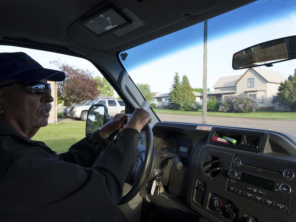 Glen Ullin Ambulance Service EMT Dwight Kuntz, who has been on the crew for 48 years, drives the team's vehicle through Glen Ullin on May 25.