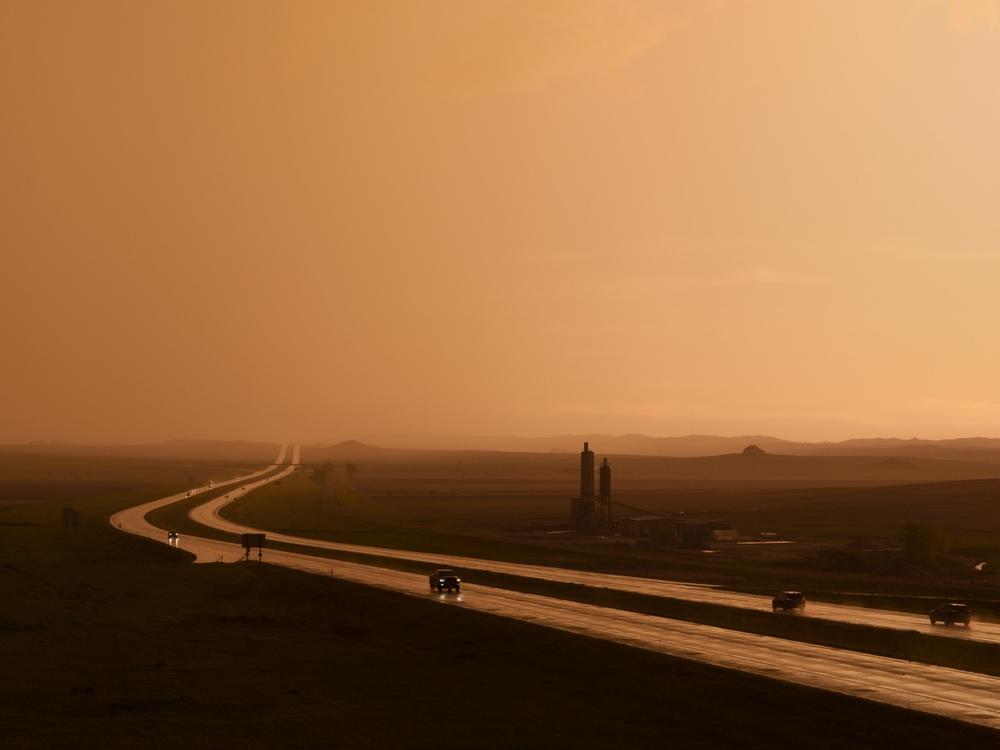A rainstorm passes over Interstate 94 in Morton County, N.D., on May 25. Inclement weather and long travel distances to medical providers present serious access barriers for seniors here, many of whom are not able to drive or are uncomfortable driving in low-visibility conditions. 