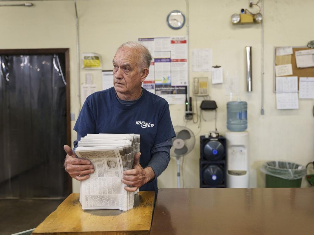 Adolfo Pino, 73, prepares a batch of local newspapers for delivery during a work shift at Rocket Printing in Armour on May 29. Pino, a Cuban immigrant, is a participant in the Older Adult Resource Network, which connects people aged 65 and older in South Dakota’s Douglas and Charles Mix counties to resources to maintain their quality of life. Pino and his wife Neri Jorge Cruz have benefited in various ways from the program, including Spanish translation for medical appointments as well as financial assista…