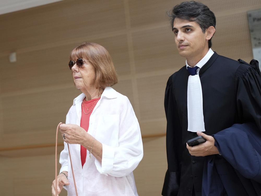 Gisèle Pélicot (left) arrives in the Avignon court house, in Avignon, southern France, on Thursday.