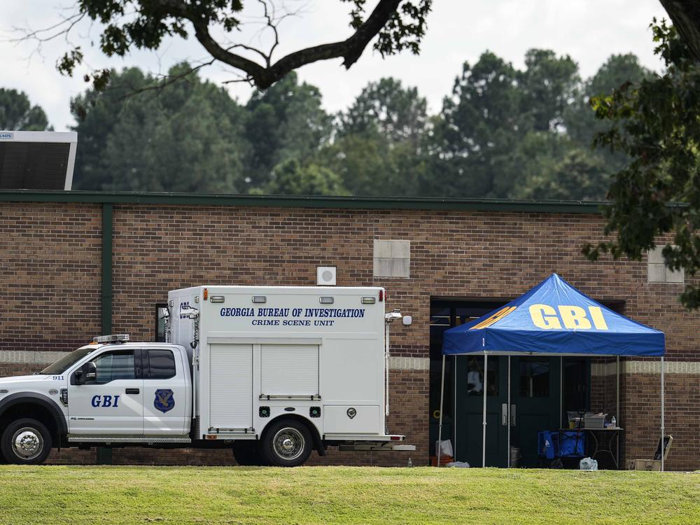 Georgia Bureau of Investigation staff move through an entrance to Apalachee High School in Winder, Ga., on Thursday.  