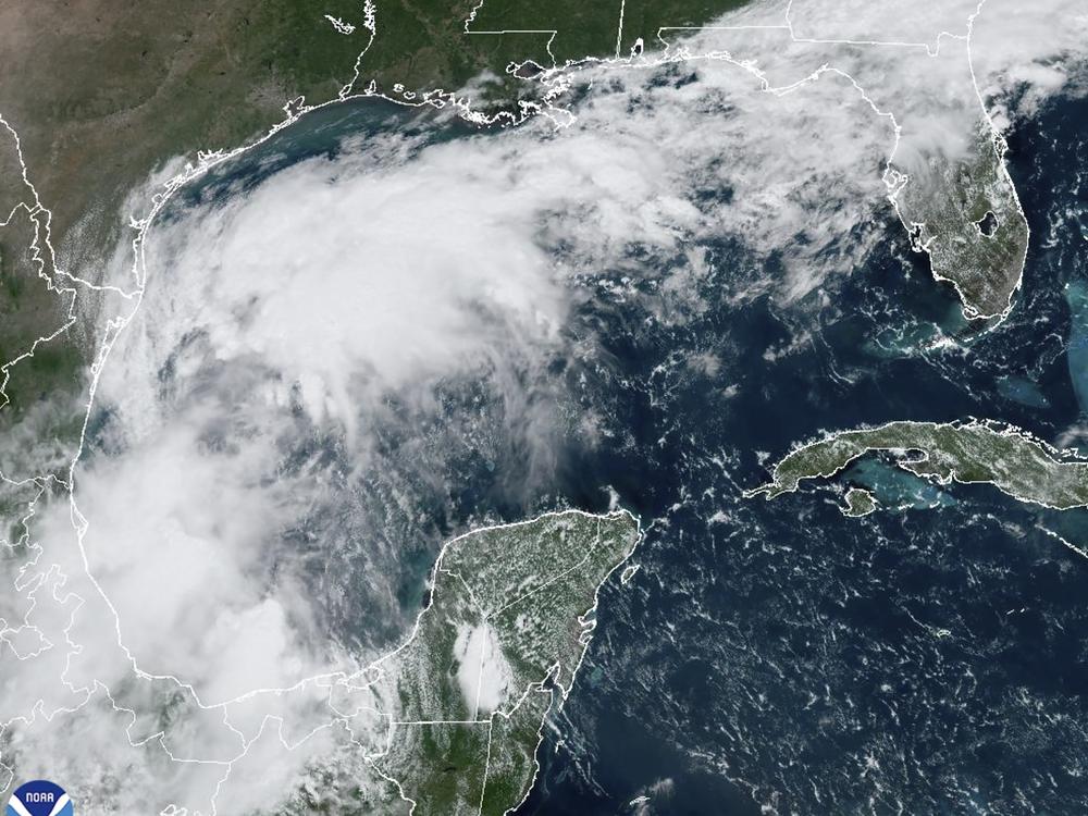 A satellite image shows a tropical disturbance in the Gulf of Mexico on Sunday that formed into Tropical Storm Francine on Monday.
