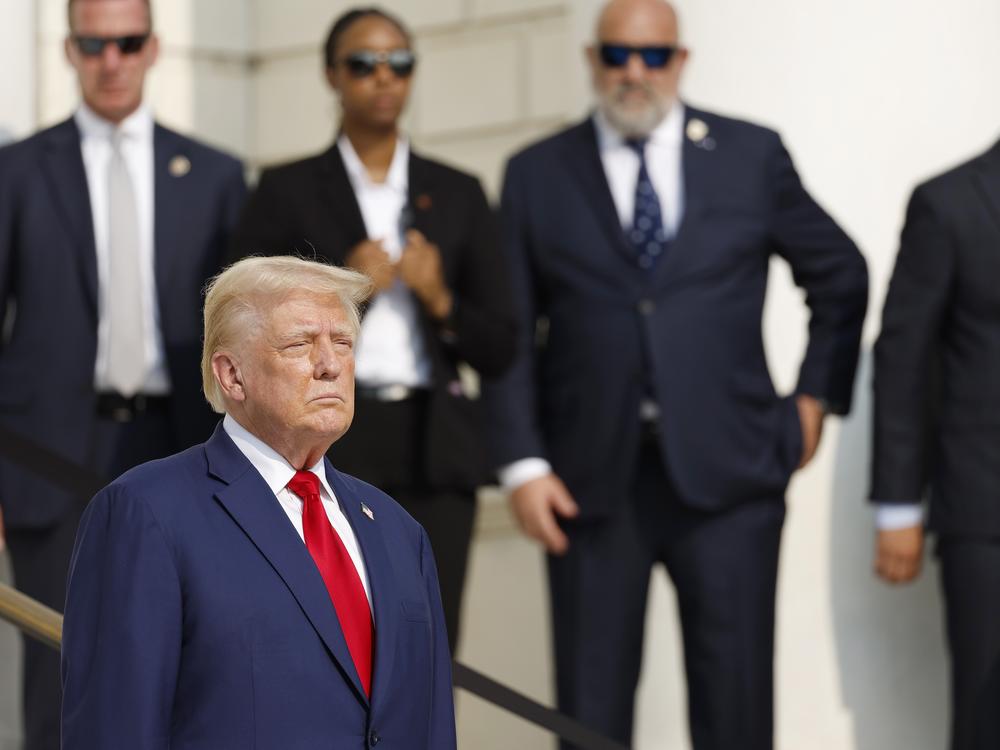 Republican presidential nominee, former President Donald Trump looks on during a wreath laying ceremony at the Tomb of the Unknown Soldier at Arlington National Cemetery on August 26, 2024 in Arlington, Virginia.
