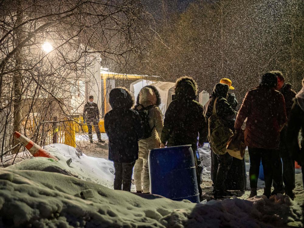 Migrants from Venezuela, Nigeria, Haïti and other countries arrive at the Roxham Road border crossing in Roxham, Quebec, on March 2, 2023. 