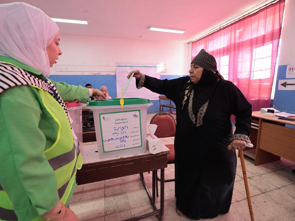 An Jordanian citizen votes in historic elections for the Parliament of Jordan's 138-seat lower house on Tuesday in Amman, Jordan. Voters are deciding their representatives in the 20th Lower House of Parliament. 