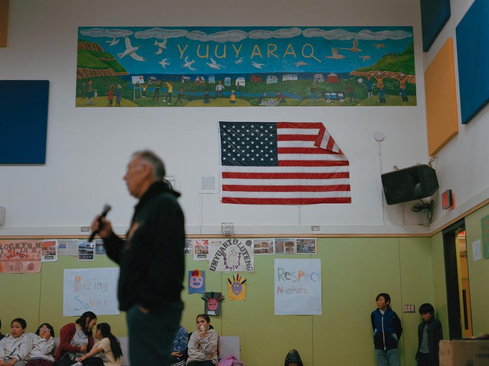Simeon John speaks about Qungasvik with a group of students at the Lower Kuskokwim Dance Festival in Tununak, Alaska. “I don’t like to think of it as a program. A program is something that has an ending,” he explains. “I want to say Yuuyaraq [a Yup’ik way of life].”