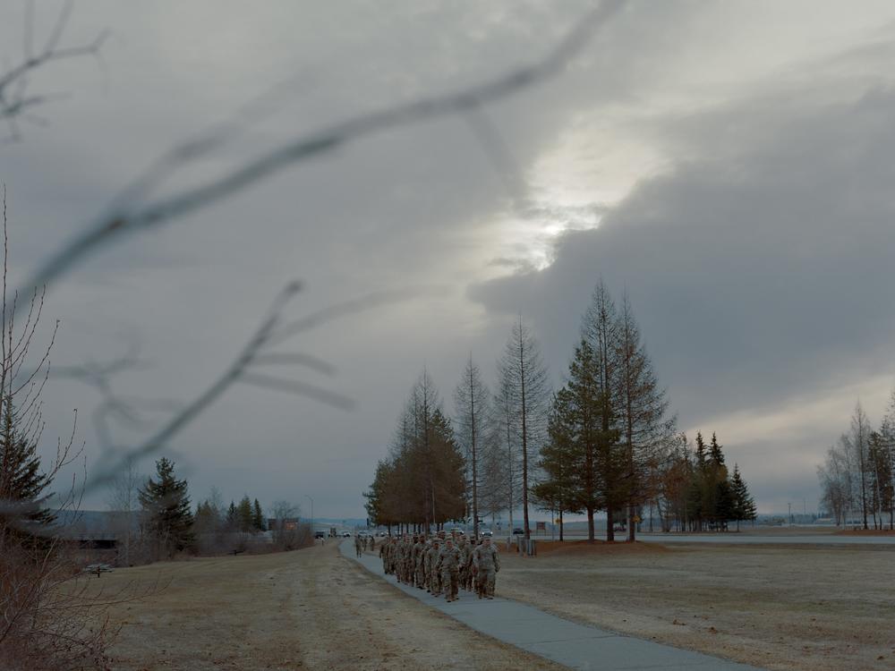 A group of soldiers from the 1st Brigade Combat Infantry Division march in formation outside Bassett Military Hospital at Fort Wainwright in Fairbanks. In 2021 there were 17 suicides in the Division, giving it one of the highest rates among a military unit nationwide. 