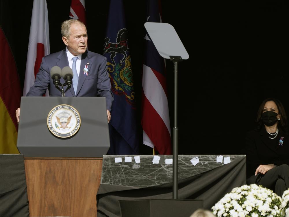 Former President George W. Bush speaks during a memorial for the passengers and crew of United Flight 93, Saturday Sept. 11, 2021, in Shanksville, Pa., on the 20th anniversary of the Sept. 11, 2001 attacks, as Vice President Kamala Harris looks on, right.