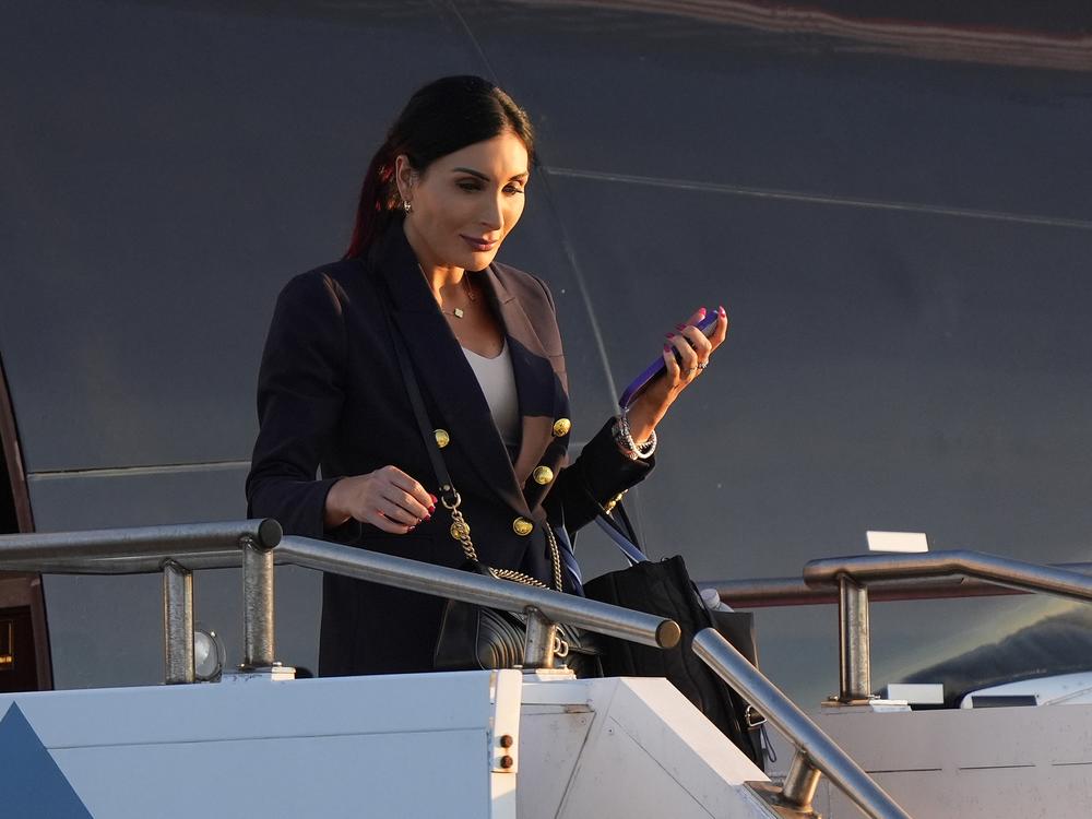 Laura Loomer arrives with Donald Trump at Philadelphia International Airport on Tuesday for the presidential debate.