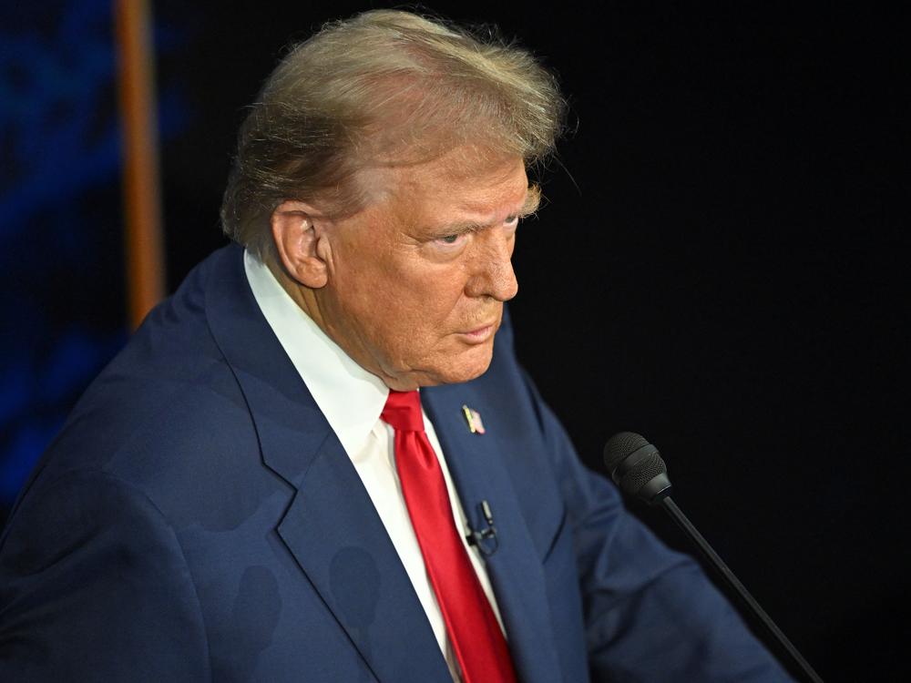 Donald Trump listens during the presidential debate with Kamala Harris.