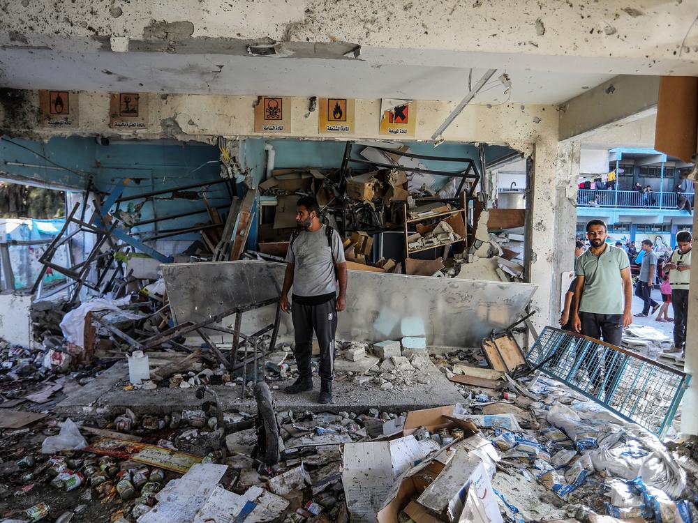 Civil defense teams and others carry out search and rescue operations after an Israeli strike on a school that was sheltering families at Nuseirat Refugee Camp in the Gaza Strip on Wednesday.