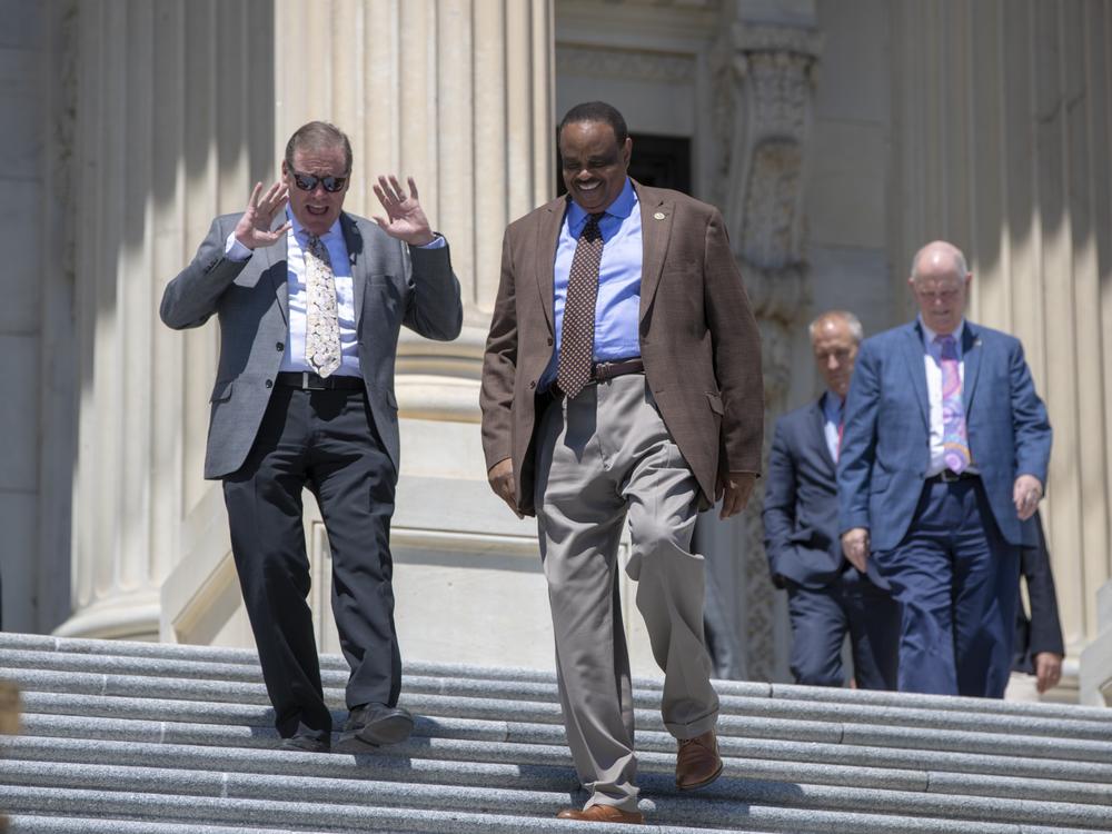 Rep. Neal Dunn, R-Fla., left, and former Rep. Al Lawson, D-Fla., center, are seen exiting the Capitol in Washington on June 15, 2018. After redistricting changed Florida's congressional districts, Dunn defeated Lawson in the 2022 election.