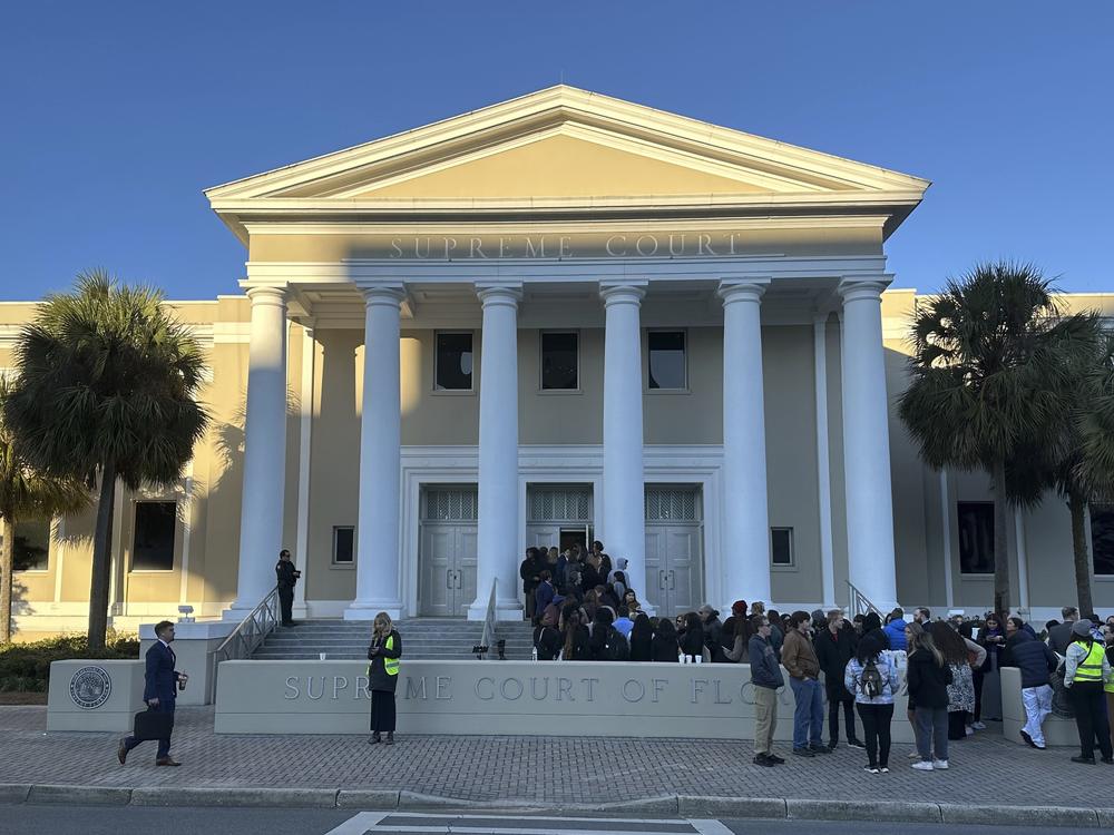 People gather outside the Florida Supreme Court in Tallahassee earlier this year. Voting rights groups challenging the state’s congressional map are counting on the court to reinstate a district that gave Black voters in the northern part of the state the opportunity to elect their candidate of choice.