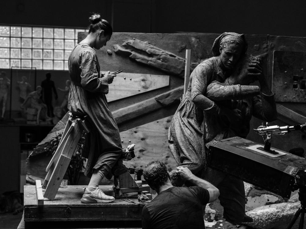 Artist Sabin Howard works on <em>A Soldier's Journey</em>, a 25-ton, 60-foot long bronze sculpture that commemorate Americans who fought in World War I. The national memorial will sit on Washington, D.C.'s Pennsylvania Avenue. 