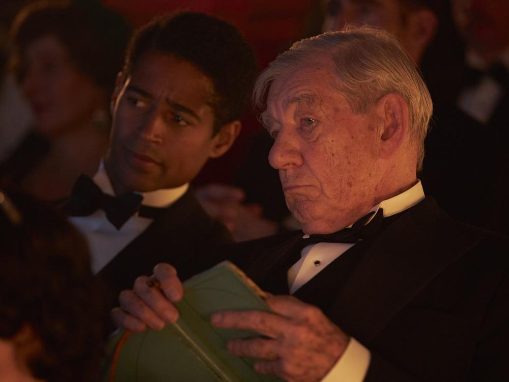In <em>The Critic</em>, Ian McKellen plays Jimmy Erskine, a theater critic who is openly gay at a time when homosexual relations were against the law in the United Kingdom. He is shown here with Alfred Enoch, in the role of Jimmy's lover, Tom Turner.