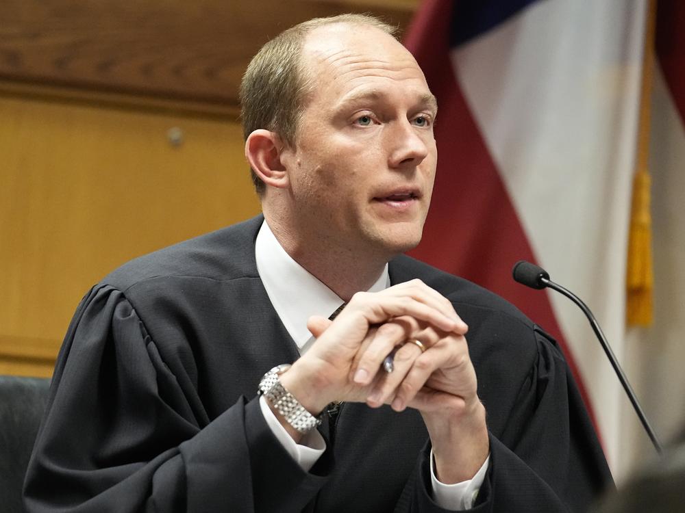 Fulton County Superior Judge Scott McAfee presides in court during a hearing in the Georgia election interference case.