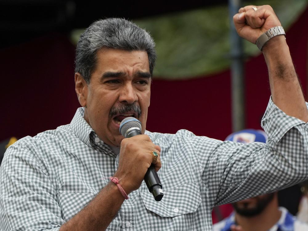 Venezuelan President Nicolas Maduro addresses government loyalists gathered at the presidential palace in support of his reelection one month after the presidential vote, in Caracas, Venezuela on Aug. 28, 2024.