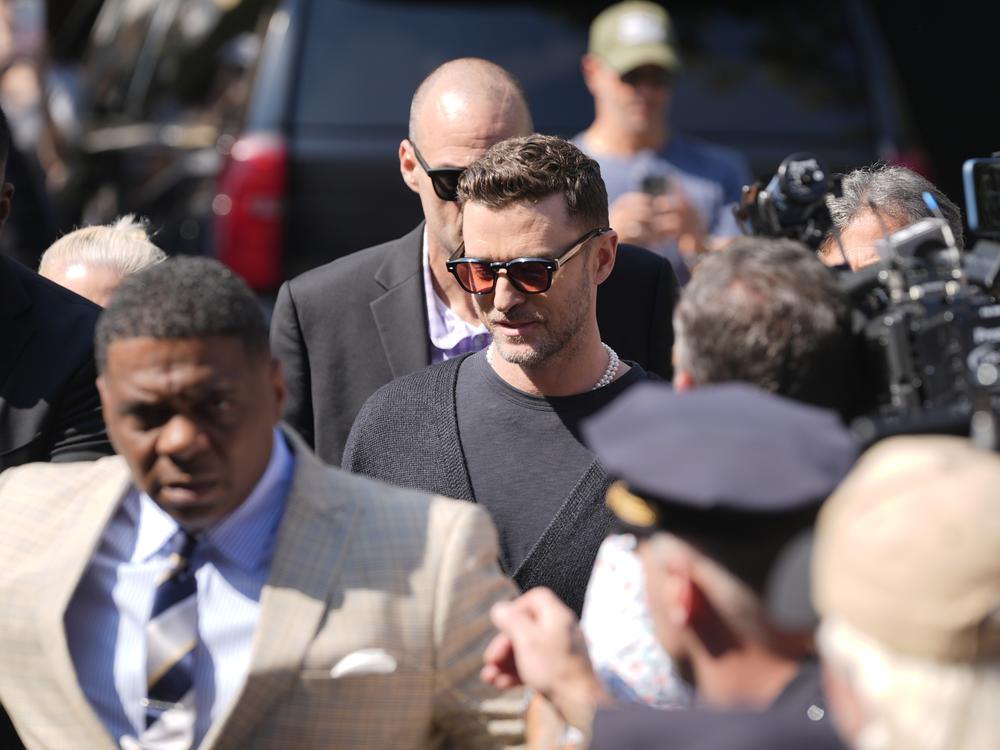 Justin Timberlake (center) walks into court for a hearing Friday in Sag Harbor, N.Y.