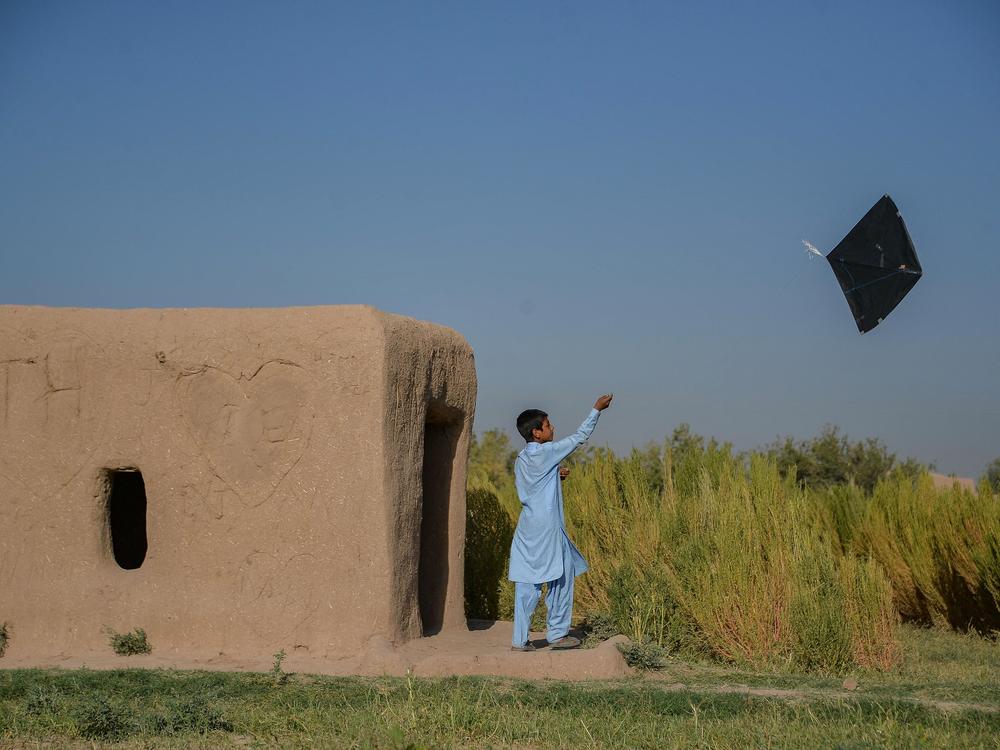 An Afghan boy flies a kite on the outskirts of Herat in September 2021. 