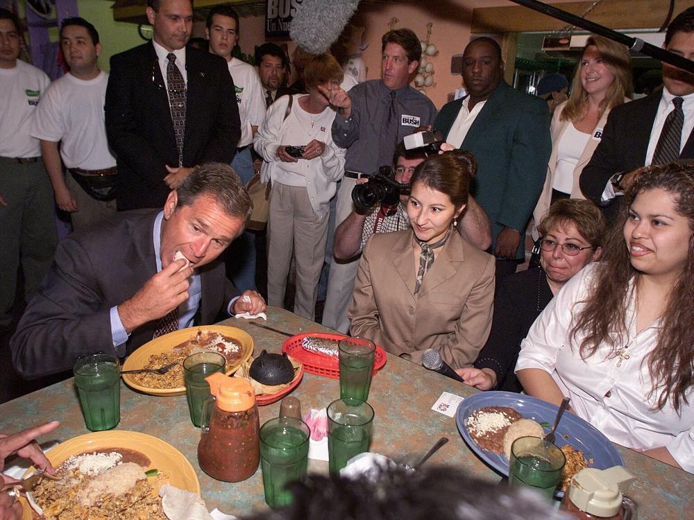 Texas Gov. George W. Bush, then a Republican candidate for president, attends a Hispanic community breakfast at Jalapeno's restaurant on Aug. 13, 1999, in Davenport, Iowa.