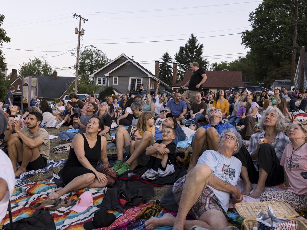 Spectators see the first sighting of Vaux's swifts for the evening at Chapman Elementary in Portland, Oregon on September 8, 2024.