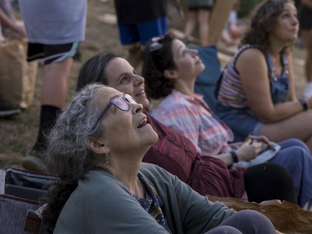 Hester Van Heemstra watches Vaux's swifts swirl in the sky at Chapman Elementary in Portland, Oregon.