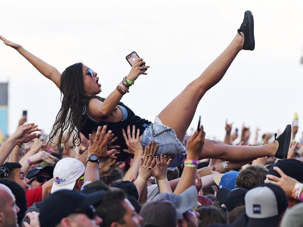 A crowd surfer celebrates Taking Back Sunday’s performance during the second and final day of the Warped Tour music festival in Atlantic City, N.J., on June 30, 2019.