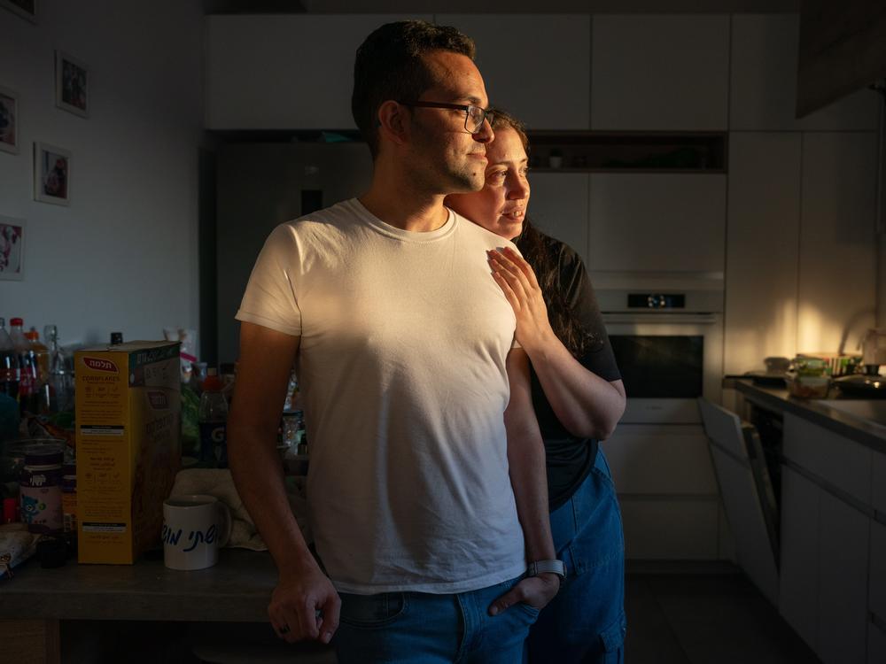 Shlomy Green, 37, and wife Inbal Green, 40, pack their home in Rishon Letsiyon, Israel, on July 11. The couple decided to leave Israel with their four-year-old daughter Riley and move to Thailand.