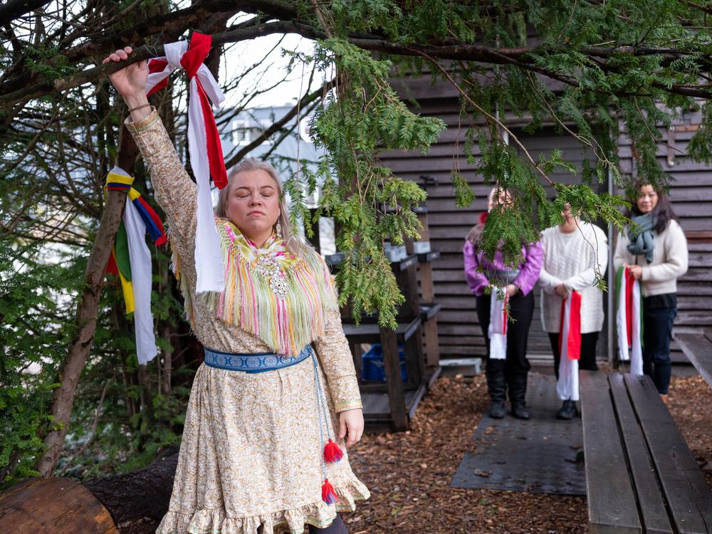 <em>Anne Merete Gaup, a Sámi woman from Norway, prepares for the ceremony.</em>