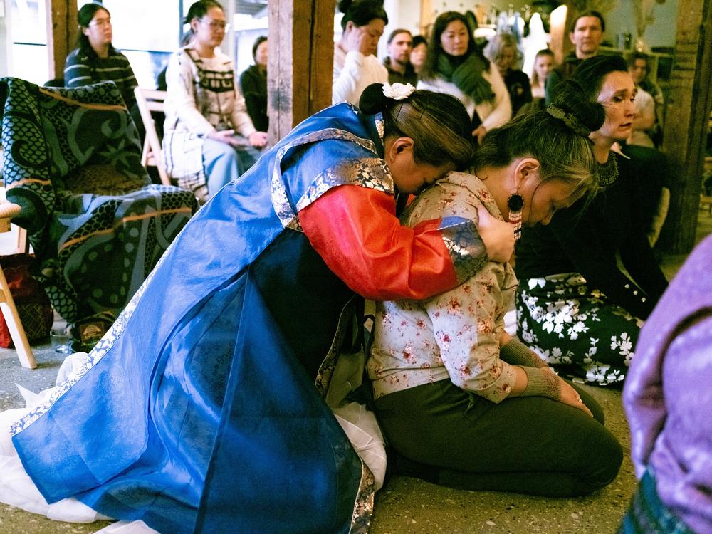 <em>Helena spends time with each participant. As she holds Kâlánguak Absalonsen, the Inuit ancestors say, through Helena, “Fly high, don’t let them drag you down.”</em>