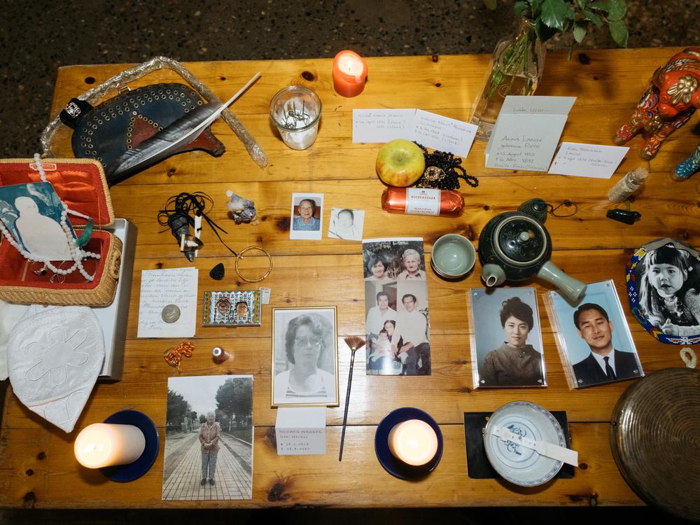 <em>An ancestral altar is covered with objects brought by the ceremony’s participants. </em>