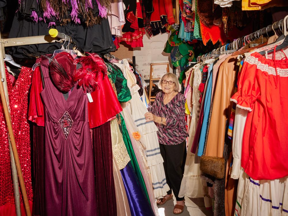 Ursula Boschet, 90, owner of Ursula’s Costumes, browses through the handmade costumes in her shop.