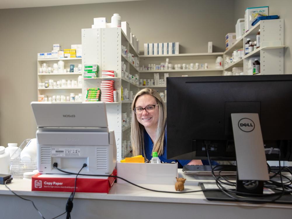 Brooke Williams works at the pharmacy counter at the PhiferCares Clinic outside Tuscaloosa, Alabama. At no cost, Phifer employees and their families can visit and get basic primary care, including prescription drugs. 