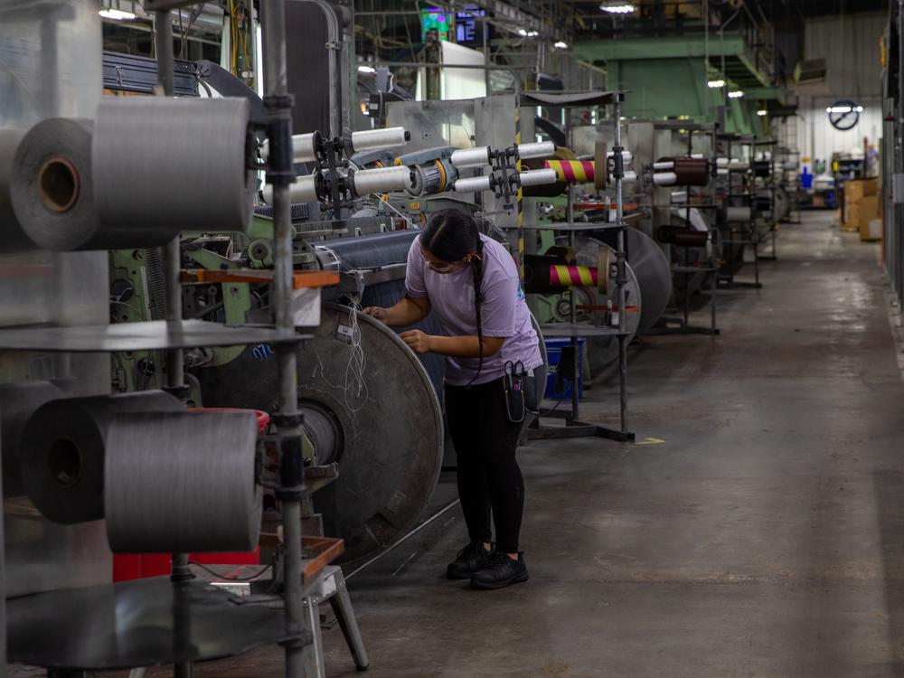 Alexandra Vazquez works in the Phifer factory, a window screen manufacturer outside Tuscaloosa, Alabama.  