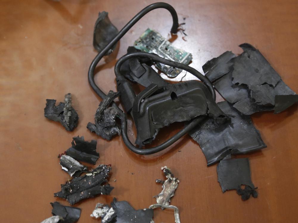 This photo, taken Wednesday in Beirut's southern suburbs, shows the remains of exploded pagers on display at an undisclosed location. Hundreds of pagers used by Hezbollah members exploded across Lebanon on Tuesday, killing at least 12 people and wounding around 2,800 in blasts that the Iranian-backed militant group blames on Israel. 