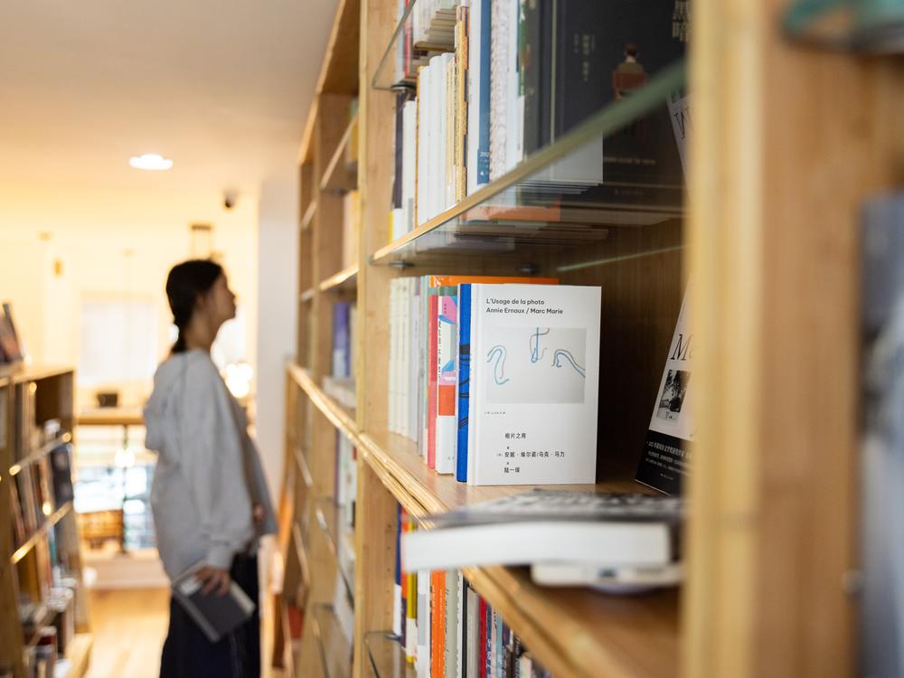 A customer browses titles at JF Books on September 17, 2024.