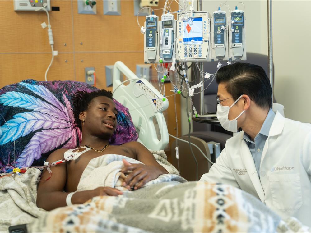As his stem cells are collected, DeShawn “DJ” Chow talks about his upcoming sickle cell gene therapy treatment with pediatric hematologist-oncologist Leo Wang at City of Hope Children’s Cancer Center on May 22. 