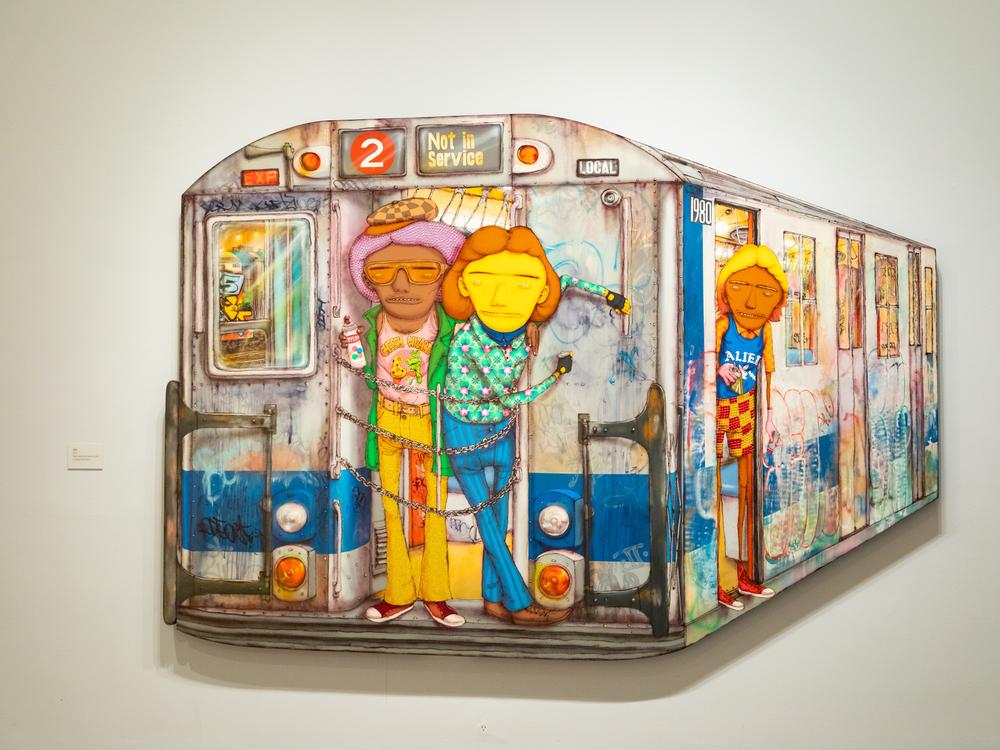 Shown is “1980” made in 2020. Mixed media with sequins on MDF.