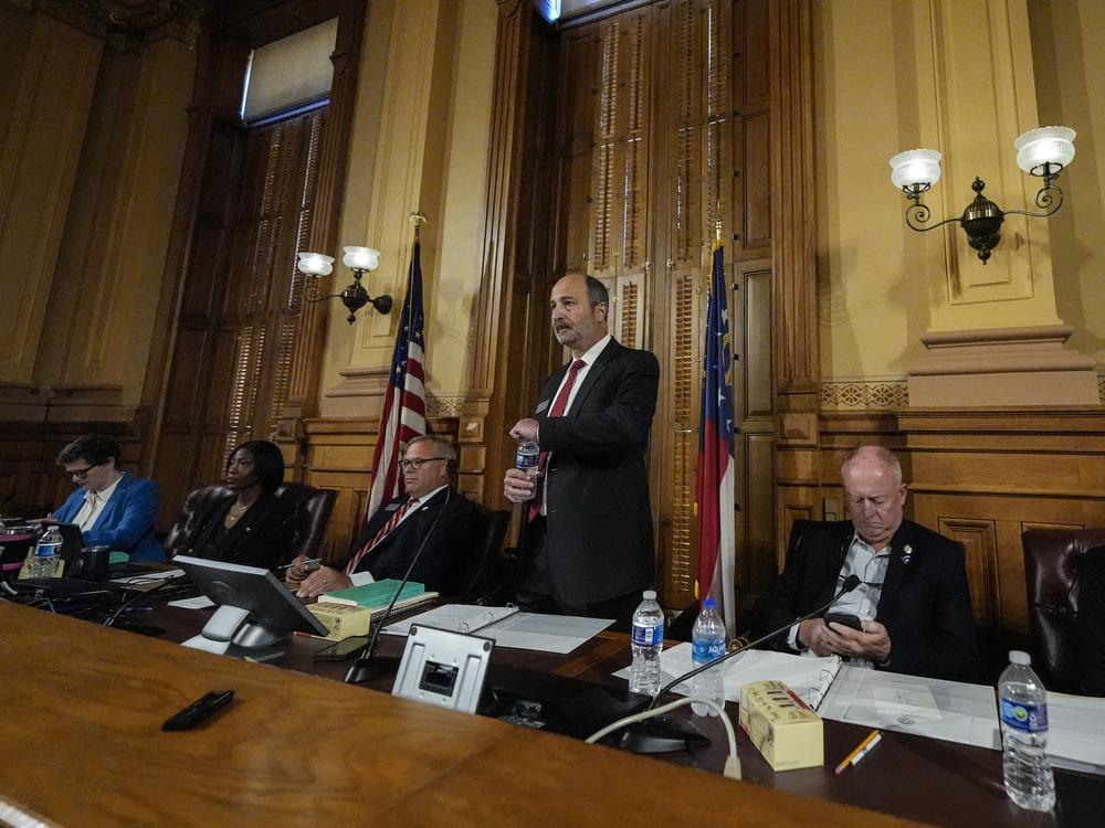 Georgia's State Election Board members meet to discuss proposals for election rule changes at the state capitol in Atlanta Friday.