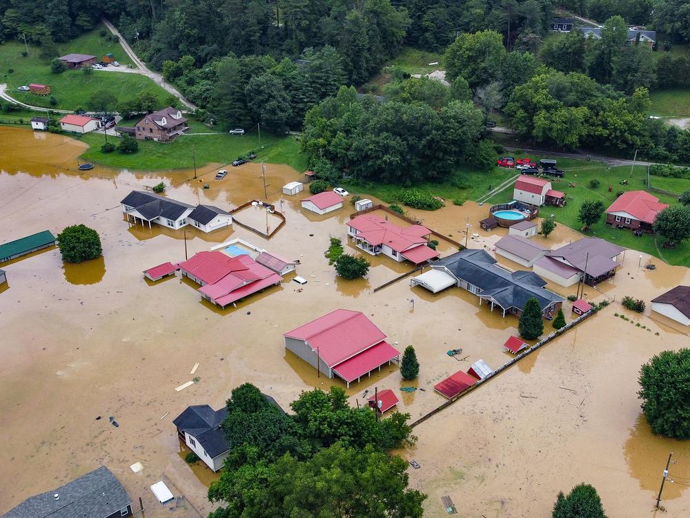 Homes underwater after flooding in July 2022 in Jackson, Kentucky. Tony Calhoun lost everything he had in the flood. “He just could not handle it,” his fiancee Edith Lisk says. “It was too overwhelming, the magnitude of it.”