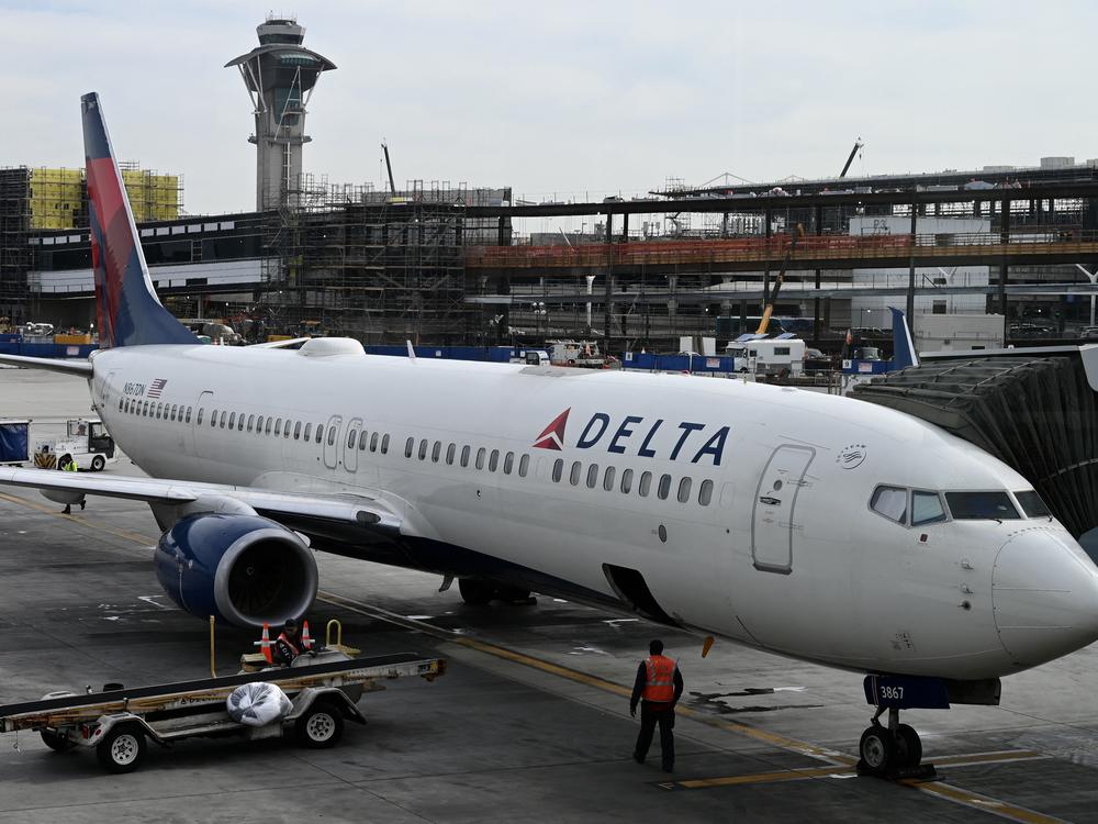 A Delta Air Lines plane is seen at Los Angeles International Airport on Jan. 11, 2023. Earlier this week, a cabin pressurization issue aboard a Delta flight caused a number of passengers to bleed from the nose and ears.