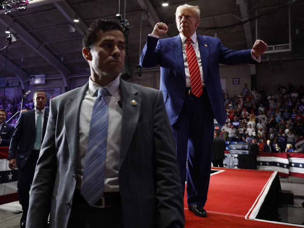 Surrounded by U.S. Secret Service agents, the Republican presidential nominee, former President Donald Trump, dances his way offstage.