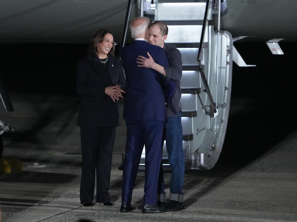 President Biden hugs Evan Gershkovich, a <em>Wall Street Journal</em> reporter freed by Russia in a multinational prisoner exchange, on Aug. 1, 2024 at Joint Base Andrews in Maryland.