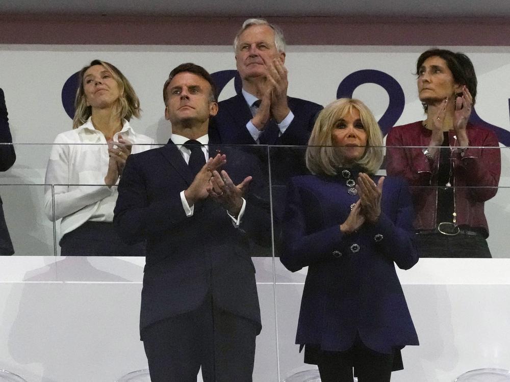 French Prime Minister Michel Barnier, background center, French President Emmanuel Macron, foreground left, and Macron's wife, Brigitte Macron, foreground right, applaud during the closing ceremony of the 2024 Paralympics on Sept. 8 in Paris.