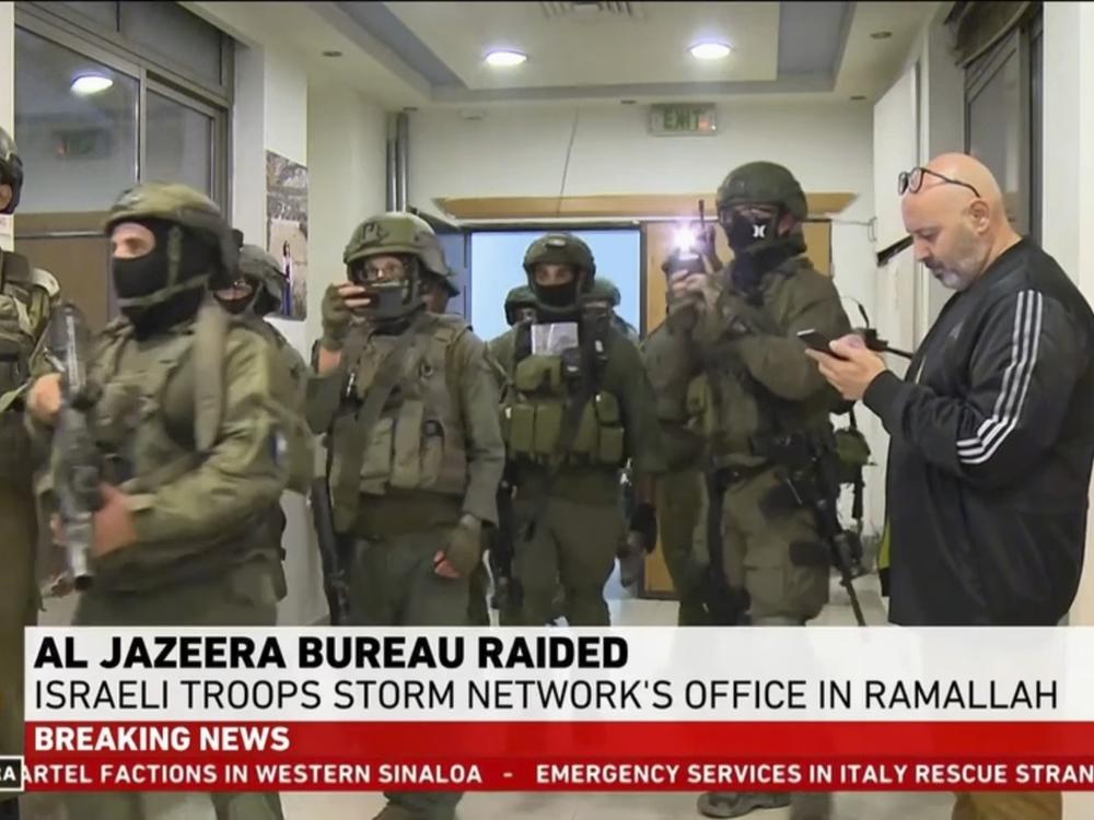 This image made from video provided by Al Jazeera English shows Israeli troops raiding their bureau in Ramallah, West Bank, Sunday, Sept. 22, 2024.
