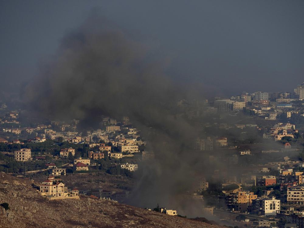 Smoke rises from an Israeli airstrike on Kfar Rouman village, as seen from Marjayoun town, south Lebanon, on Monday.