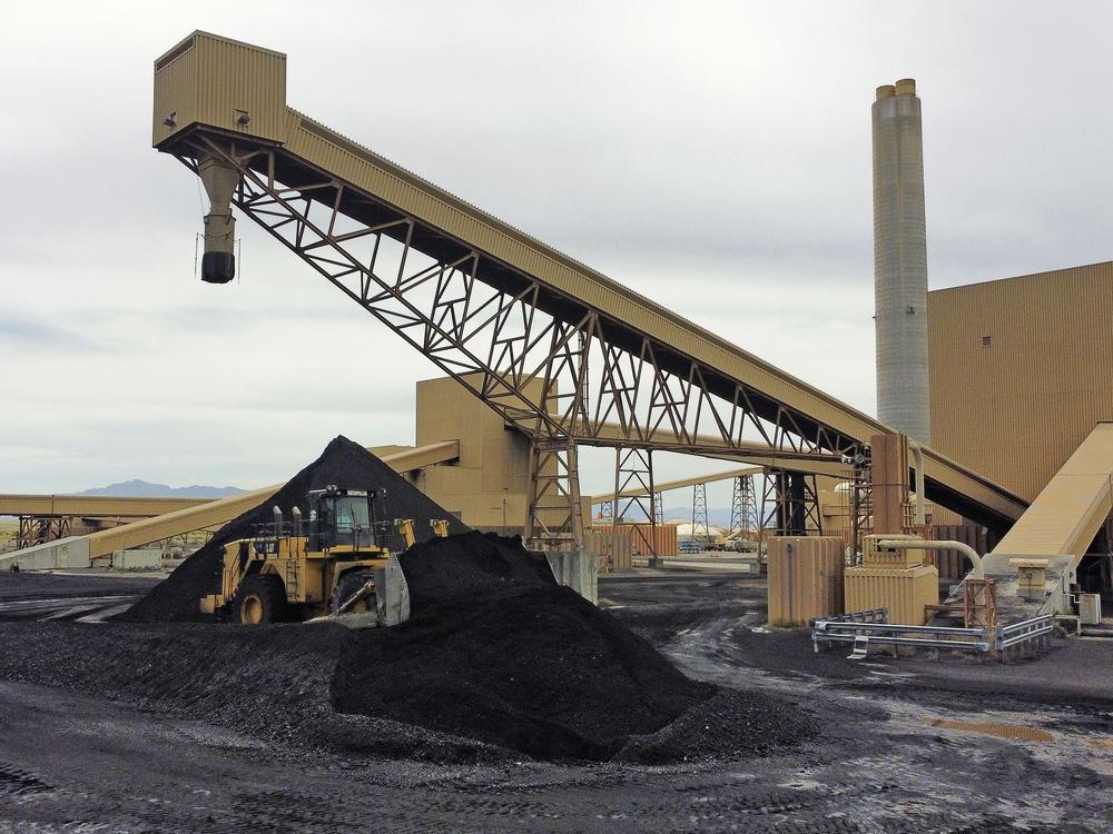 Piles of coal wait to be burned at the Intermountain Power Plant near Delta, Utah, in 2022.