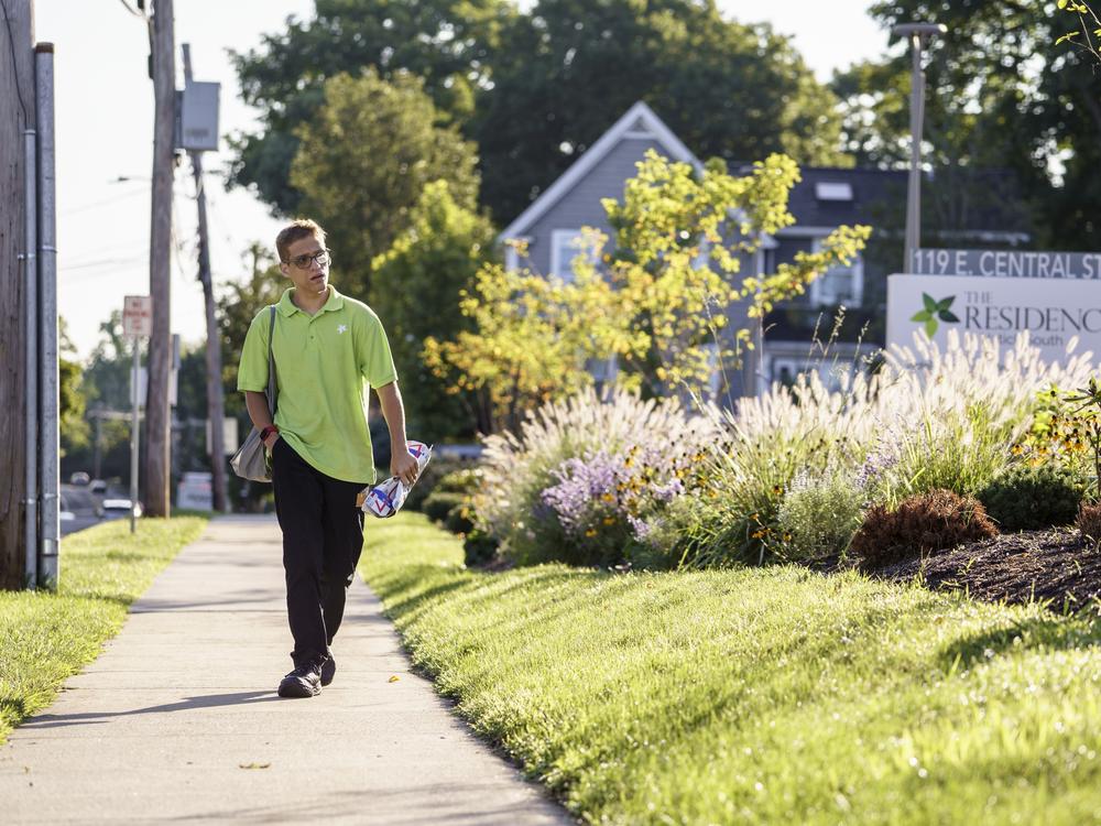 Jason Mazzola walks to work at The Residence at Natick South, an LCB Senior Living community in Natick, MA. August 22, 2024.<br>